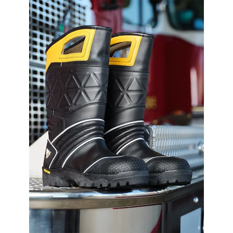 Veridian Vanquish structural firefighting boots front view resting on a table, highlighting sturdy build and protective features.