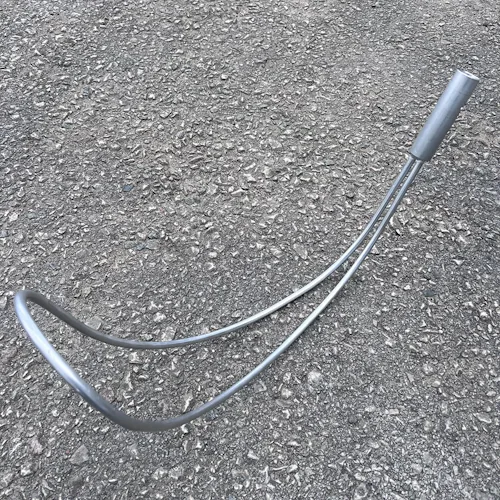 Northern Diver stainless steel Body Hook Reach Pole Attachment for water rescue, laid out on pavement showing its curved shepherd's-hook design and cylindrical grip end.