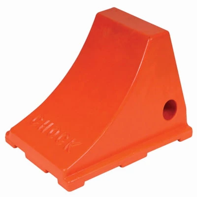 Kochek orange urethane rubber wheel chock with mounting hole.